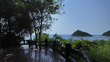 Strolling-along-a-wooden-boardwalk,-gazing-upon-the-breathtaking-vistas-of-Southeast-Asia