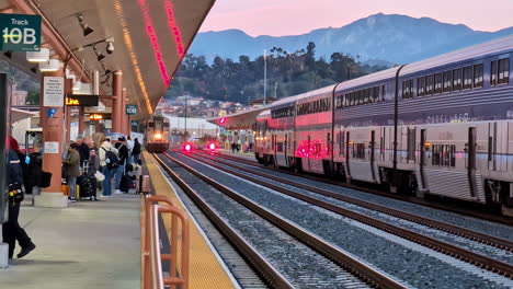 Passengers-waiting-for-train-in-Los-Angeles-station,-handheld-view