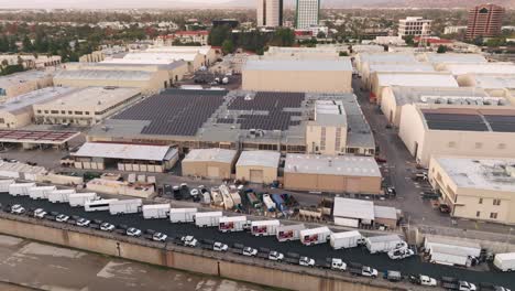 Aerial-Drone-Footage-Over-Warner-Brothers-Studio-Backlot-on-Sunny-Day-in-Los-Angeles,-LA-River-and-Soundstages-as-Seen-from-Sky