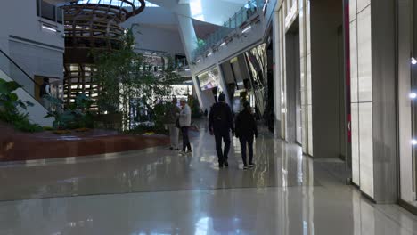 Interior-view-of-people-at-the-upscale-shopping-mall-The-Shops-at-Crystals,-Las-Vegas