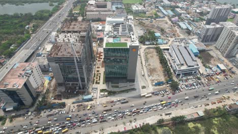 Aerial-shot-of-shell-building-with-traffic-in-highway