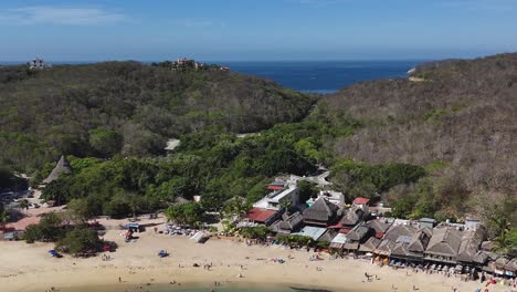 Playa-La-Entrega,-one-of-the-7-bays-in-Huatulco,-Oaxaca,-seen-by-drone