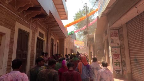 pov-shot-Many-people-are-walking-to-the-temple-which-is-surrounded-by-many-different-types-of-stalls-and-shops