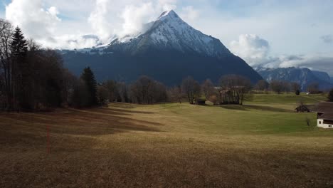 Beautiful-mountain-backdrop,-summit-of-snow,-Swiss-countryside