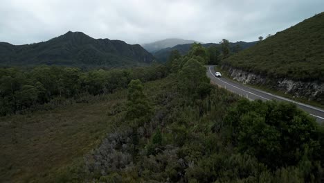 Car-Driving-On-Road-Through-Forest-Landscape-At-Franklin-Gordon-Wild-Rivers-National-Park-In-Tasmania,-Australia