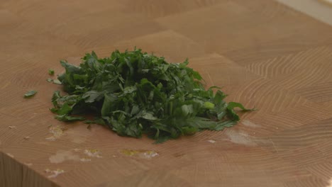 removing-the-coriander-leaves-from-the-cutting-board