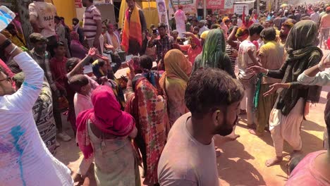 pov-shot-Many-people-are-walking-along-the-roads-and-many-different-types-of-stalls-are-also-being-seen-where-pink-colored-items-are-available