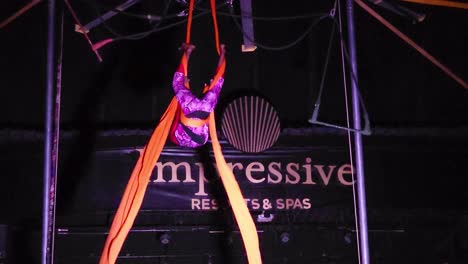 Acrobat-performs-high-above-the-floor-at-Circus-Show,-at-Impressive-Resort-and-Spa-at-Punta-Cana,-Dominican-Republic