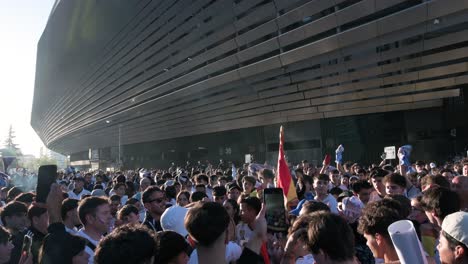 Thousands-of-fans-cheer-and-gather-at-Real-Madrid´s-Santiago-Bernabeu-stadium-as-they-attend-the-Champions-League-football-match-between-Spanish-and-British-teams-Real-Madrid-and-Manchester-City