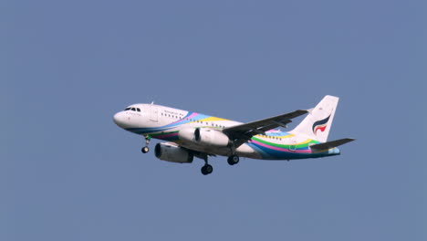 Descending-towards-the-tarmac-of-the-airport,-the-airplane-deployed-its-landing-gears-as-it-prepares-to-land-in-Bangkok,-Thailand