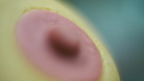 Macro-hyper-close-up-shot-of-a-silicone-nipple,-baby-equipment,-health-care,-Full-HD-,-pull-out-crane-movement