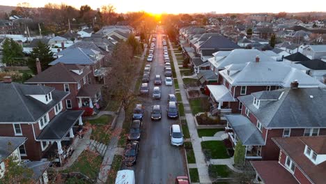 Golden-hour-sunset-over-American-neighborhood-with-many-parked-cars