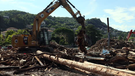 Como,-Italy---august-5-2021---excavator-working---Lake-Como-overflows-into-the-city-center-due-to-the-heavy-rains-that-have-hit-the-area-these-days