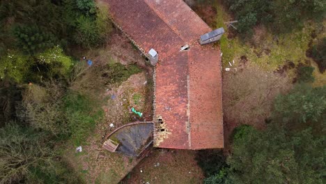 Top-down-aerial-of-abandoned-mansion-property-in-the-belgian-forest