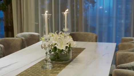 Candelabra-And-White-Stargazer-Lily-Flowers-On-Table-Centerpiece