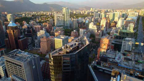 Drone-tilting-above-the-Mercado-Urbano-Tobalaba,-golden-hour-in-Santiago-de-Chile