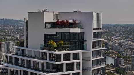 Vancouver-BC-Canada-Aerial-v114-zoomed-drone-fly-around-One-Burrard-Place-apartment-in-downtown-capturing-urban-cityscape-and-North-shore-mountain-views---Shot-with-Mavic-3-Pro-Cine---July-2023