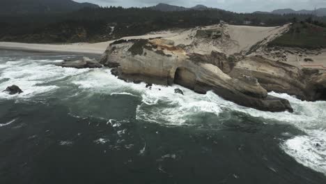 Slow-motion-scenery,-waves-crashing,-Cape-Kiwanda,-Pacific-City-Beach