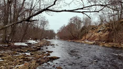 Jagala-River-Flowing-Through-The-Trees-In-Winter-In-Northern-Estonia