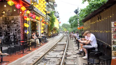 Residents-and-tourists-walking-and-waiting-on-city-train-passing