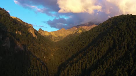 Nexpayantla-Ravine-and-the-Popocatépetl-volcano,-sunset-in-Mexico---Aerial-view