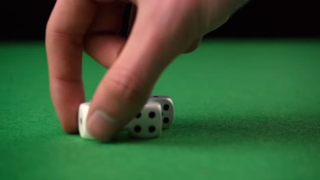 Picking-and-grabbing-dice-from-the-game-table