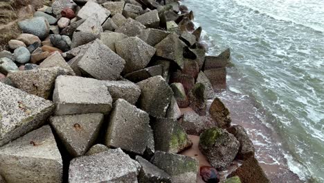 Concrete-Blocks-Along-The-Seashore-In-Baltic-Sea-In-Uzava,-Latvia,-Europe