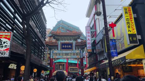 Bustling-Japan-market-walking-street-at-eclectic-store-commercial-signs-people-walk-at-Yokohama