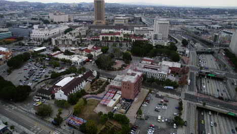 Los-Angeles-USA,-Aerial-View-of-Union-Station,-Buildings-and-Traffic-on-US-101-Highway,-Drone-Shot