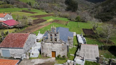 Chapel-Virgen-De-La-Victoria-In-Lush-Vilar-De-Barrio,-Spain---Aerial