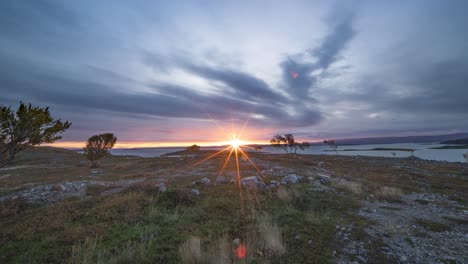 A-sun-rises-in-the-morning-sky-above-the-fjord-and-the-autumn-tundra