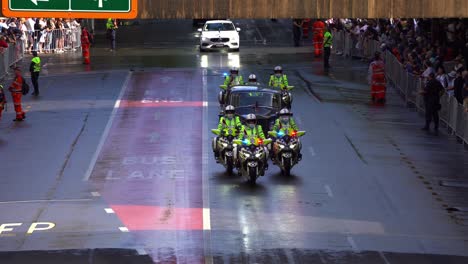 British-royal-car-escorted-down-Adelaide-Street-by-a-team-of-vigilant-police-officers-on-motorbikes-during-the-annual-Anzac-Day-parade-tradition-in-Brisbane-city