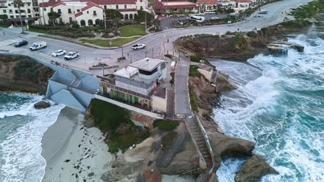 Counter-Clockwise-Circular-rotation-Hyperlapse-shot-shortly-after-sunrise-with-waves-crashing-on-the-beach-and-rocks-and-sea-lions-visible-on-the-beach-of-the-Children's-Pool