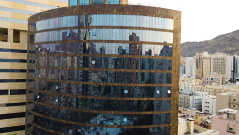 Drones-eye-view-of-the-city-reflected-in-the-windows-of-one-of-Hotel-buildings-in-Makkah