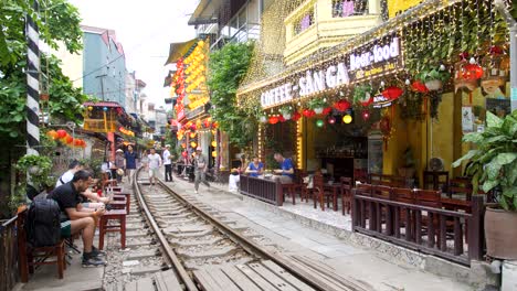 City-train-street,-small-number-of-tourists,-famous-Asian-landmarks