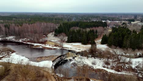 Dry-winter-landscape-in-north-european-countrysde-aerial-drone-fly-forest-lake-natural-environment,-panoramic-view