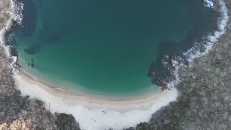 Aerial-perspective-captures-Bahia-el-Organo,-an-unspoiled-beach-in-Huatulco,-Oaxaca,-Mexico