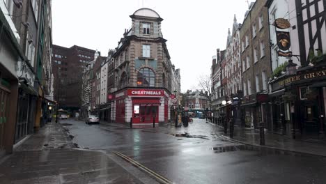 Wet-Morning-On-Corner-Of-Greek-Street-Looking-Down-Moor-Street-And-Old-Compton-Road-In-Soho,-London