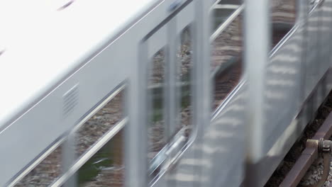 Silver-subway-train-passing-through-in-Vienna