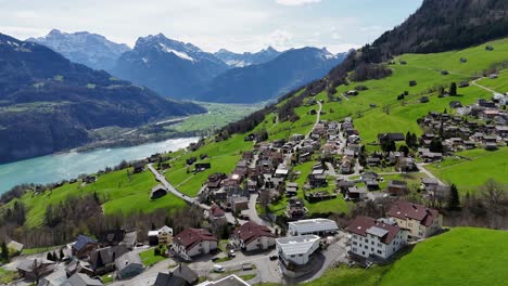 Swiss-town-located-on-green-mountain-with-Lake-Walen-in-the-valley