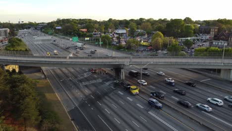 Drone-shot-pulling-out-from-the-scene-of-a-car-accident-blocking-off-interstate-traffic-in-Atlanta,-Georgia-on-April-6th,-2024