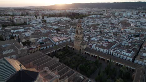 circling-aerial-view-of-mosque-cathedral-in-Cordoba,-Spain-during-blue-hour