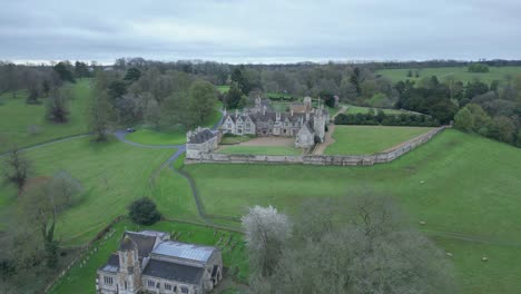 Aerial-panning-view-of-Rockingham-Castle-in-Northamptonshire,-England-during-evening