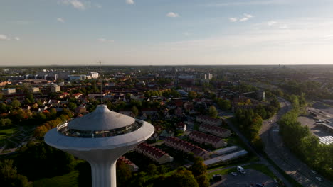 Circling-water-tower,-Svampen,-Örebro,-Sweden,-Drone-landmark,-Summer