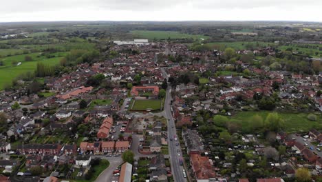 Flying-drone-shot-revealing-the-town-of-Bungay-in-Suffolk,-UK