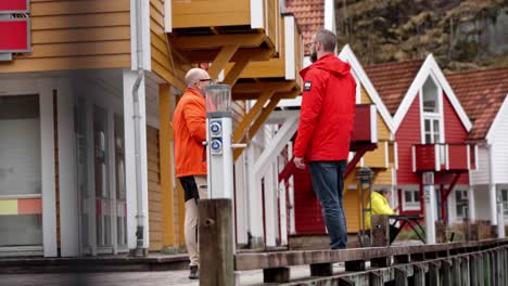 Revealing-guide-talking-to-tourist-at-dock-in-slow-motion