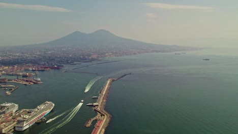 Italian-european-city-town-Naples-high-and-wide-angle-panorama-view-from-drone-with-scenery-cinematic-style-of-seashore,-boats,-ships-and-horizon