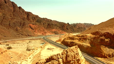 middle-of-the-desert-mountains-from-each-side-and-highway-road-split-them