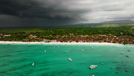 Turquoise-Blue-Sea-And-Coastal-Village-In-Nusa-Lembongan-With-Rain-Clouds-In-Bali,-Indonesia