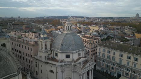 Backwards-Drone-Shot-Reveals-Domes-of-Two-Twin-Churches,-Piazza-del-Popolo